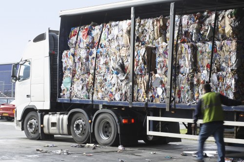 Modern office furniture being cleared by professionals